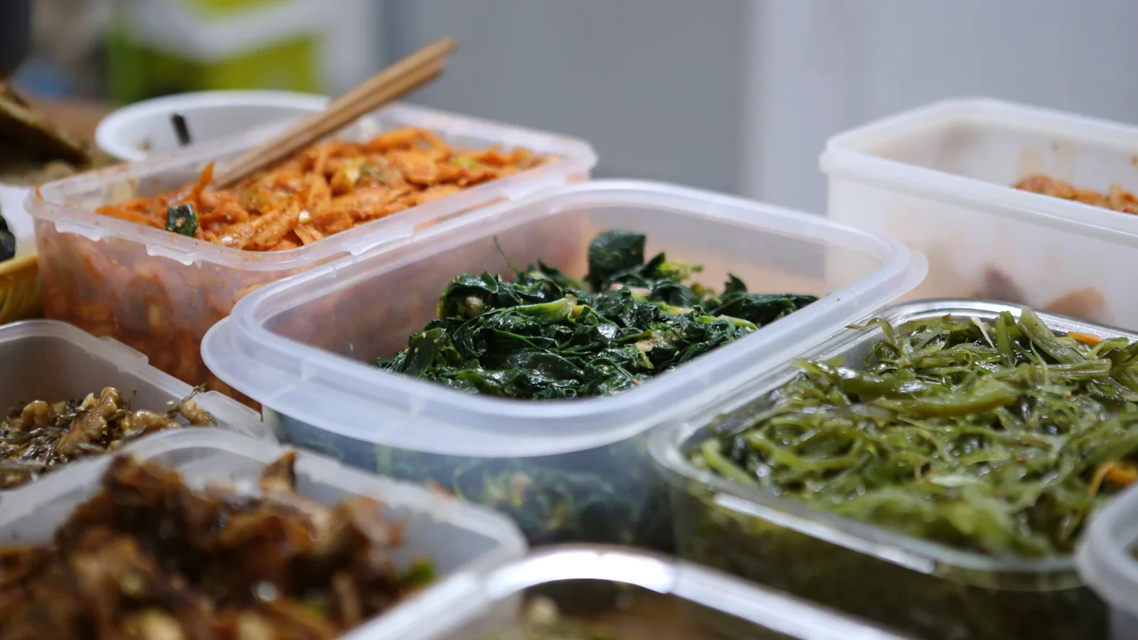 Variety of prepared meals stored in food containers