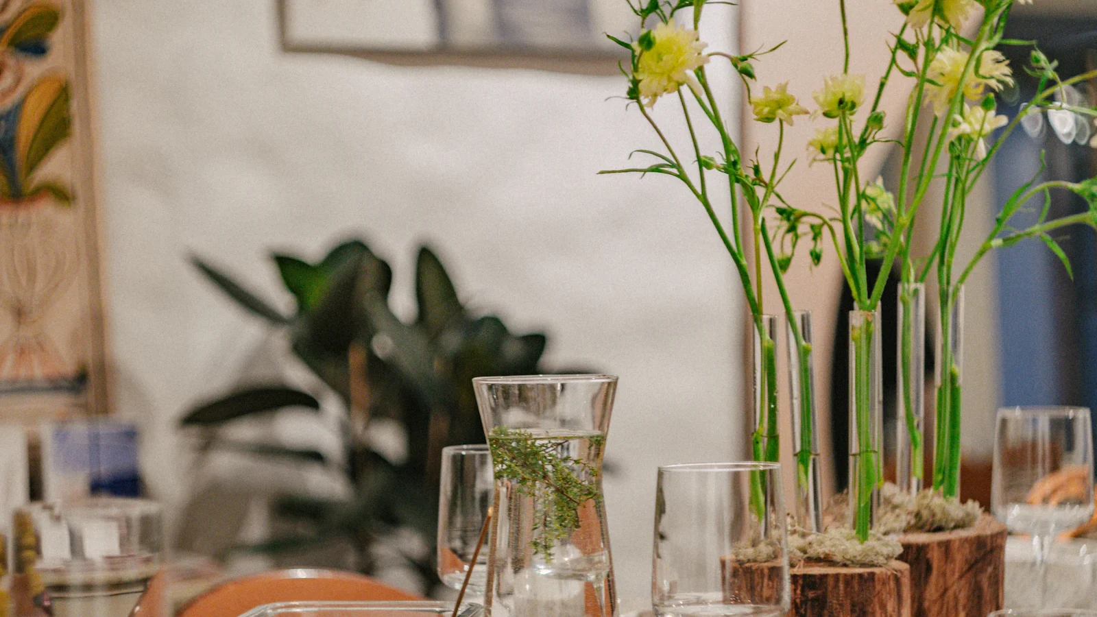 Beautifully set dining table with flowers and glasses